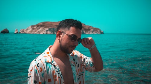 Man in Shirt on Sea Shore