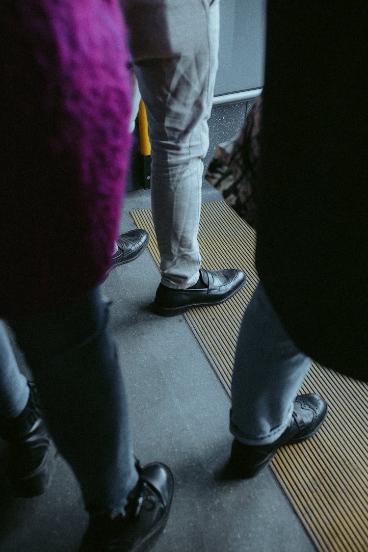 People Standing On A Bus 