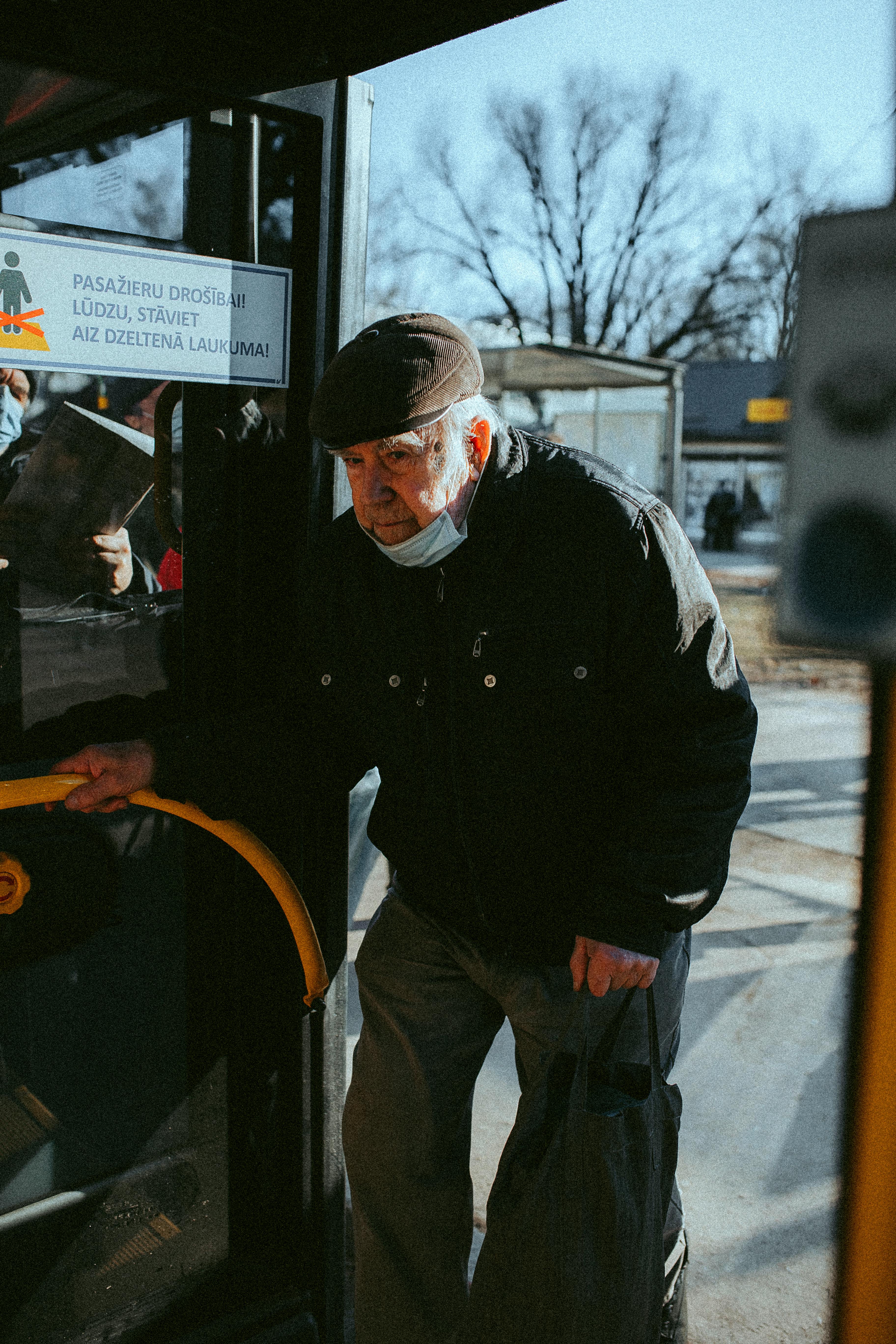 Elderly Man on Bus in Latvia
