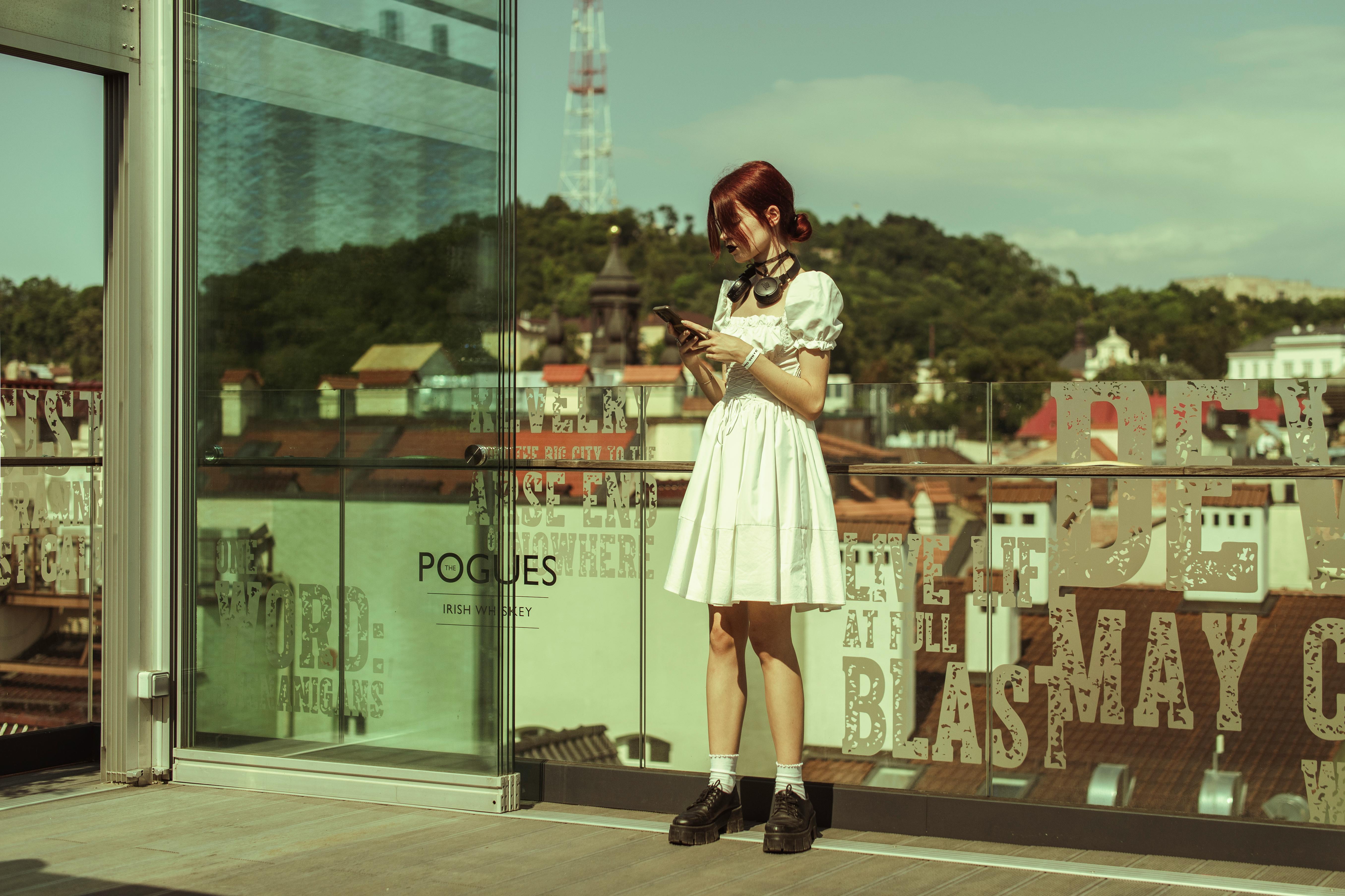 Woman Stands on Rooftop