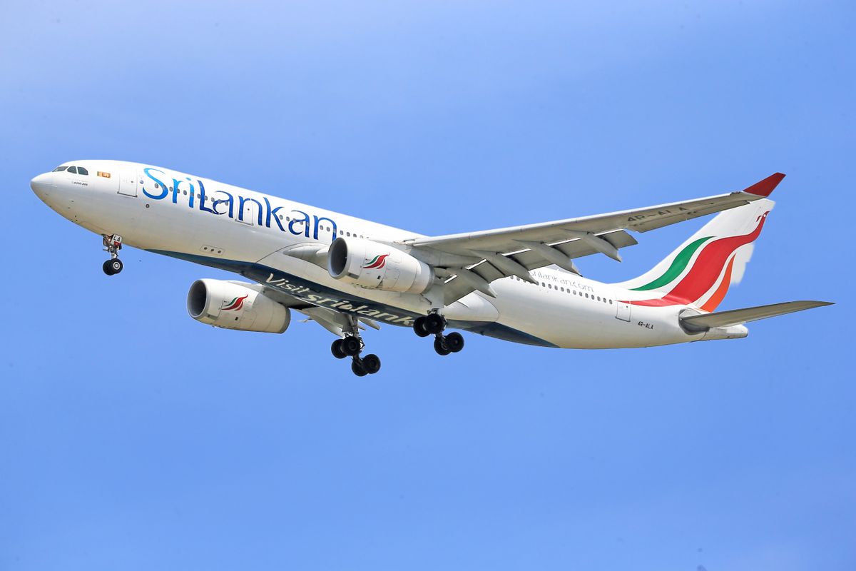 SriLankan Airlines Airbus A330 in clear sky, showcasing modern aviation and airline travel.