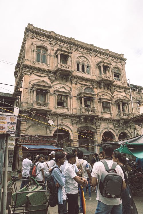 Free Crowded street market beneath historic architecture in Ahmedabad, India. Stock Photo