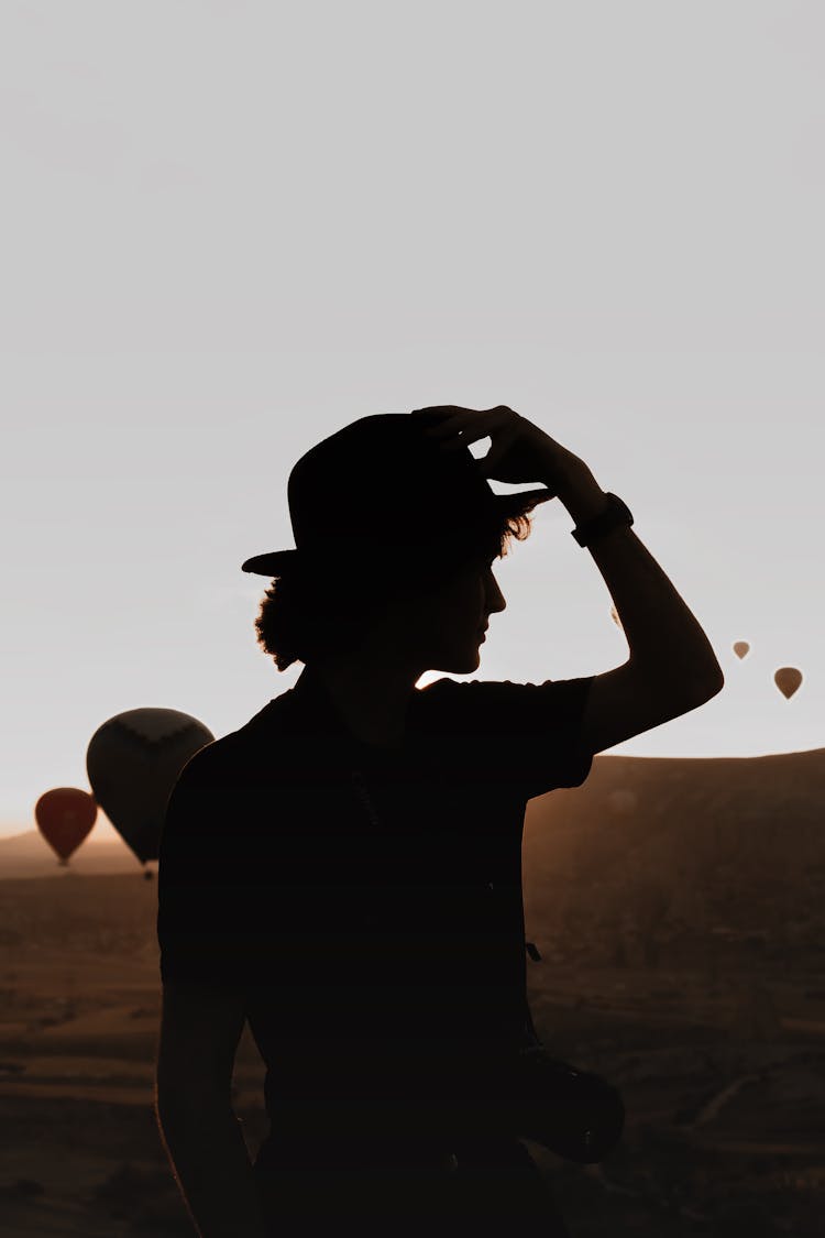 Silhouette Of Man In Hat