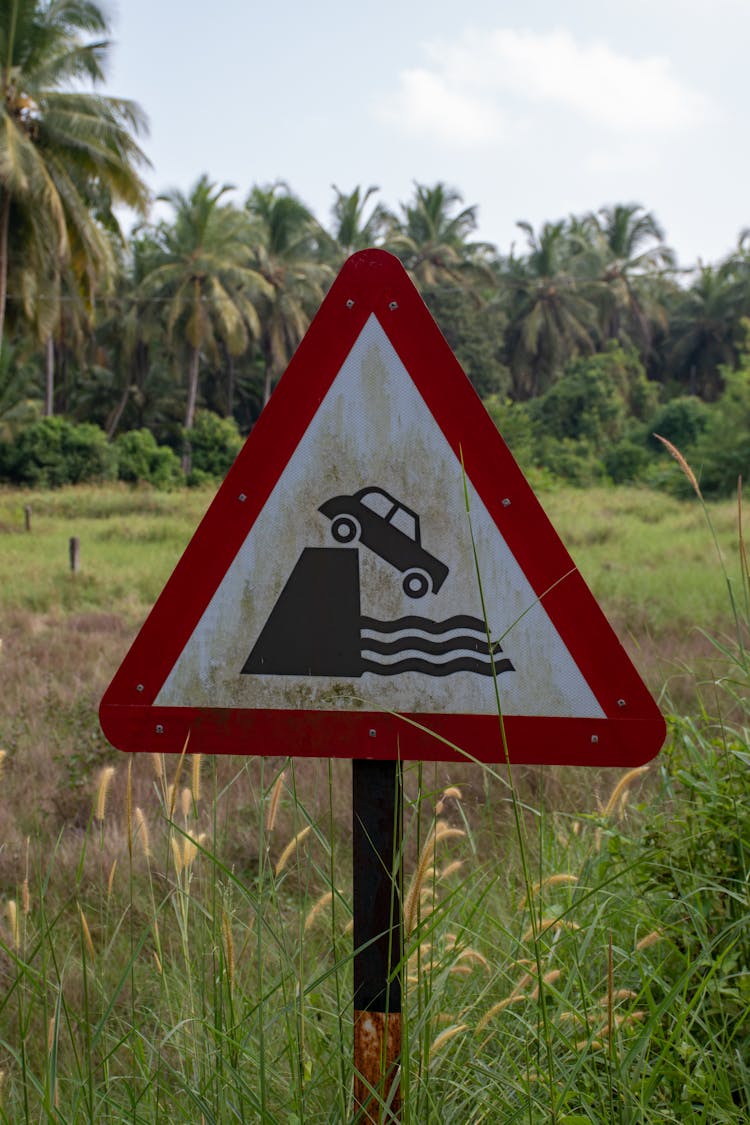 Caution Car Sign In Field