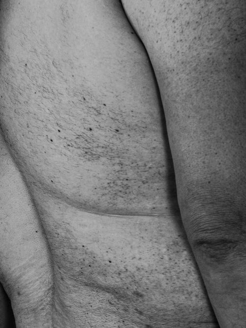 Free Detailed black and white close-up of a man's skin texture, revealing freckles and natural patterns. Stock Photo