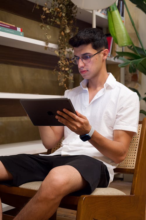 Man Sitting with Tablet