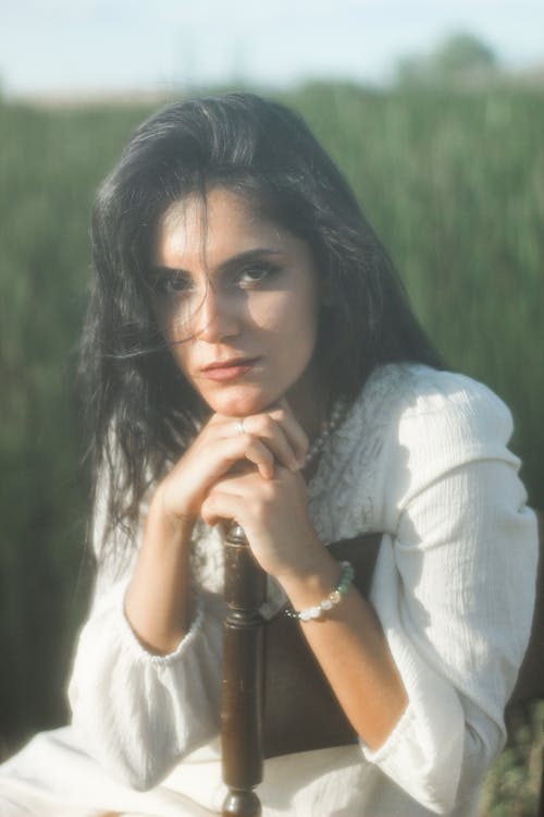 Brunette Woman Sitting on Chair