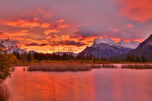 Red Sky and Lake in Mountains at Sunset