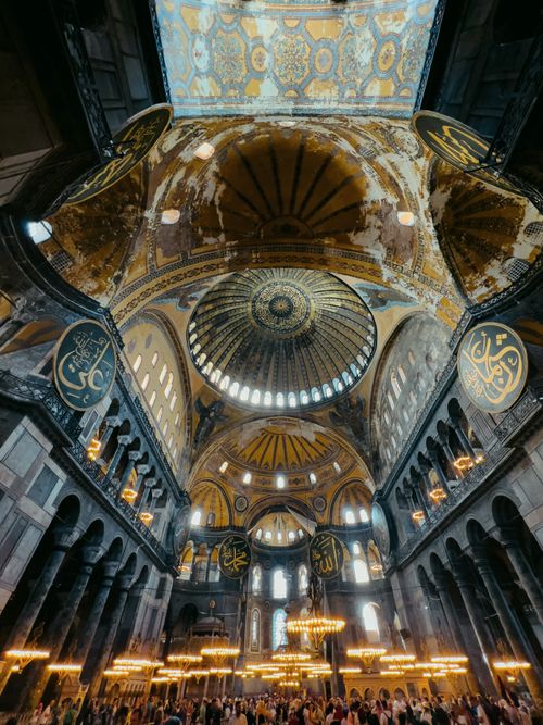 Free Stunning view of the illuminated and ornate dome interior of Hagia Sophia, showcasing historic architecture in Istanbul. Stock Photo