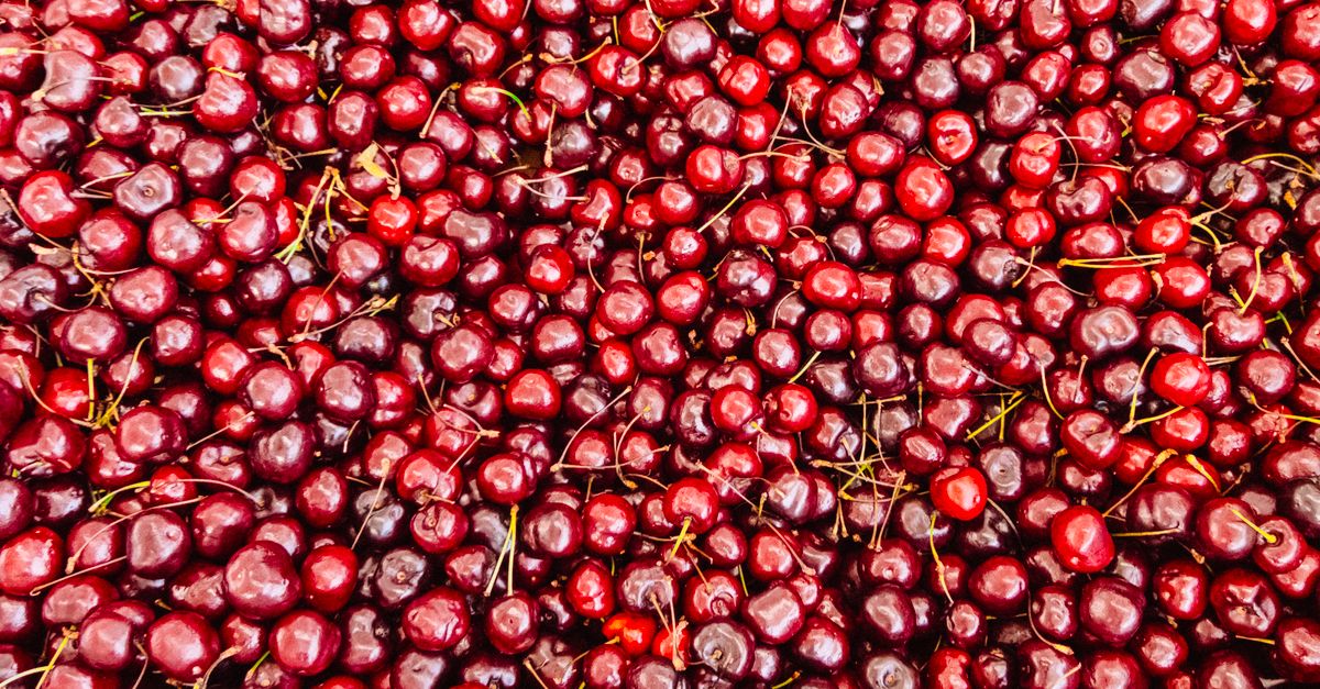 A fresh and vibrant display of red cherries offering a delicious and healthy fruit option. - Evidence evidence guide for tart cherry sleep quality randomized trial
