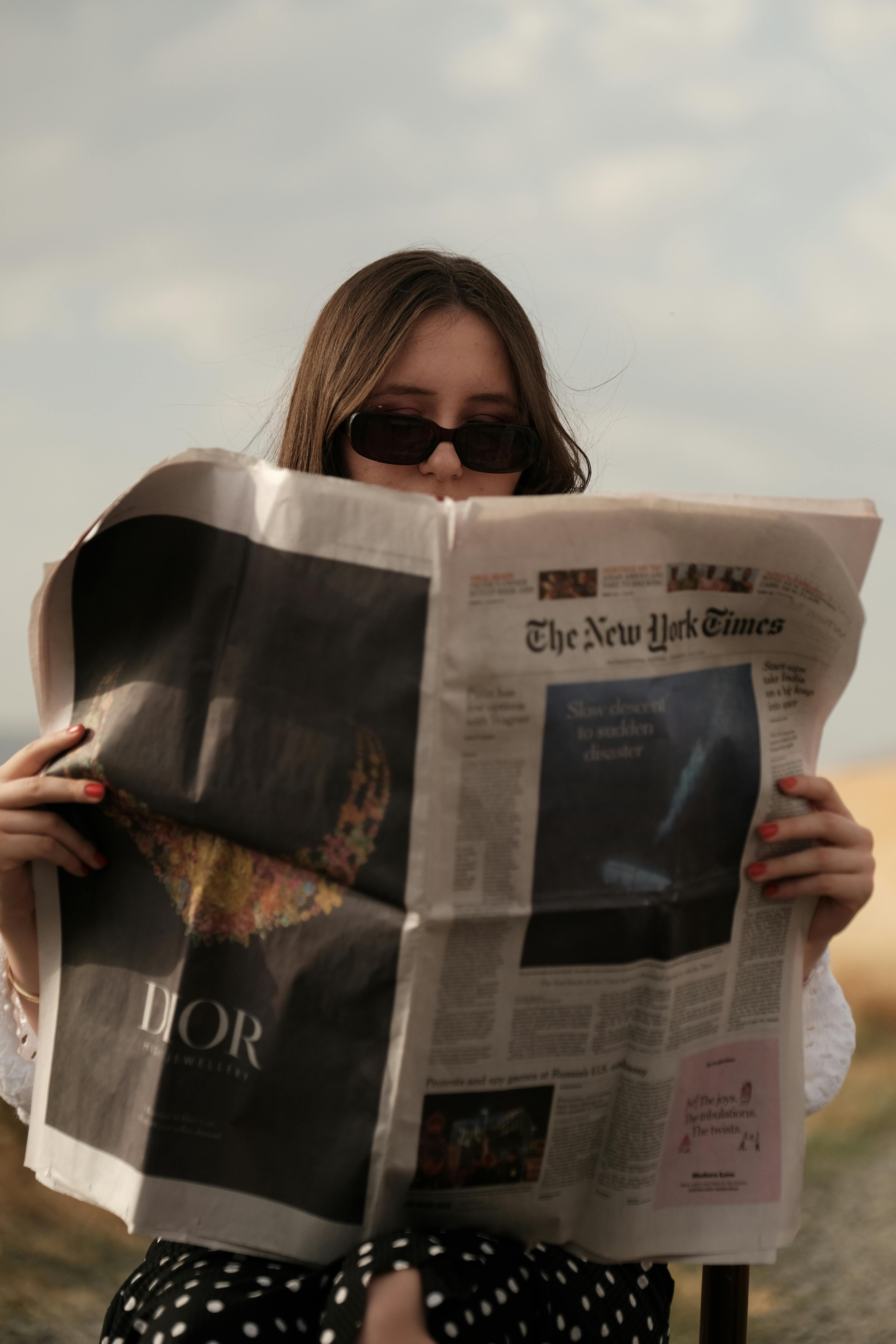 Woman Sunglasses Reads Newspaper Looks Direction Stock Photo 2373270615 |  Shutterstock