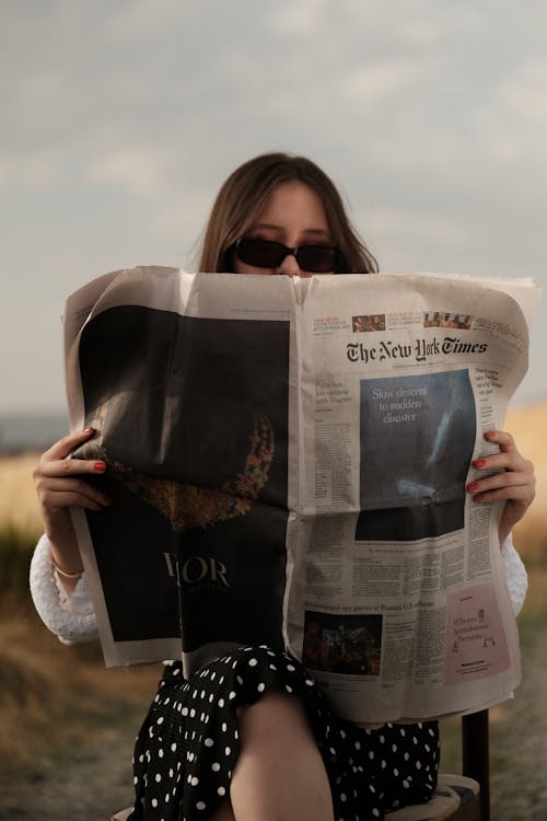 Free Woman Reading Newspaper Stock Photo