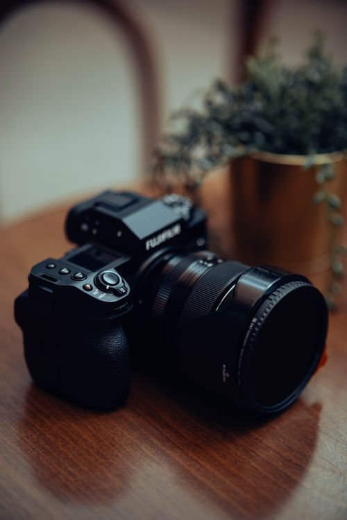 Digital Camera on a Table · Free Stock Photo