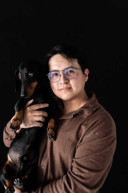 Man Holding Dachshund