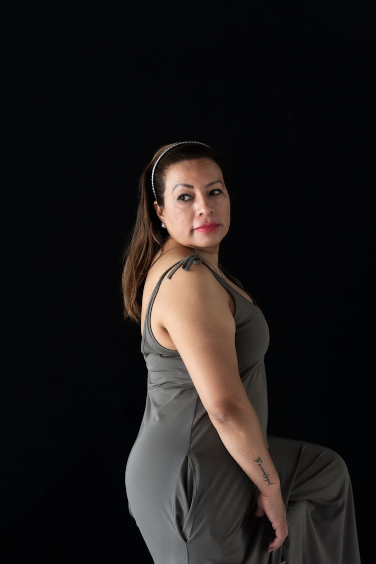 Woman Posing In Front Of Black Background