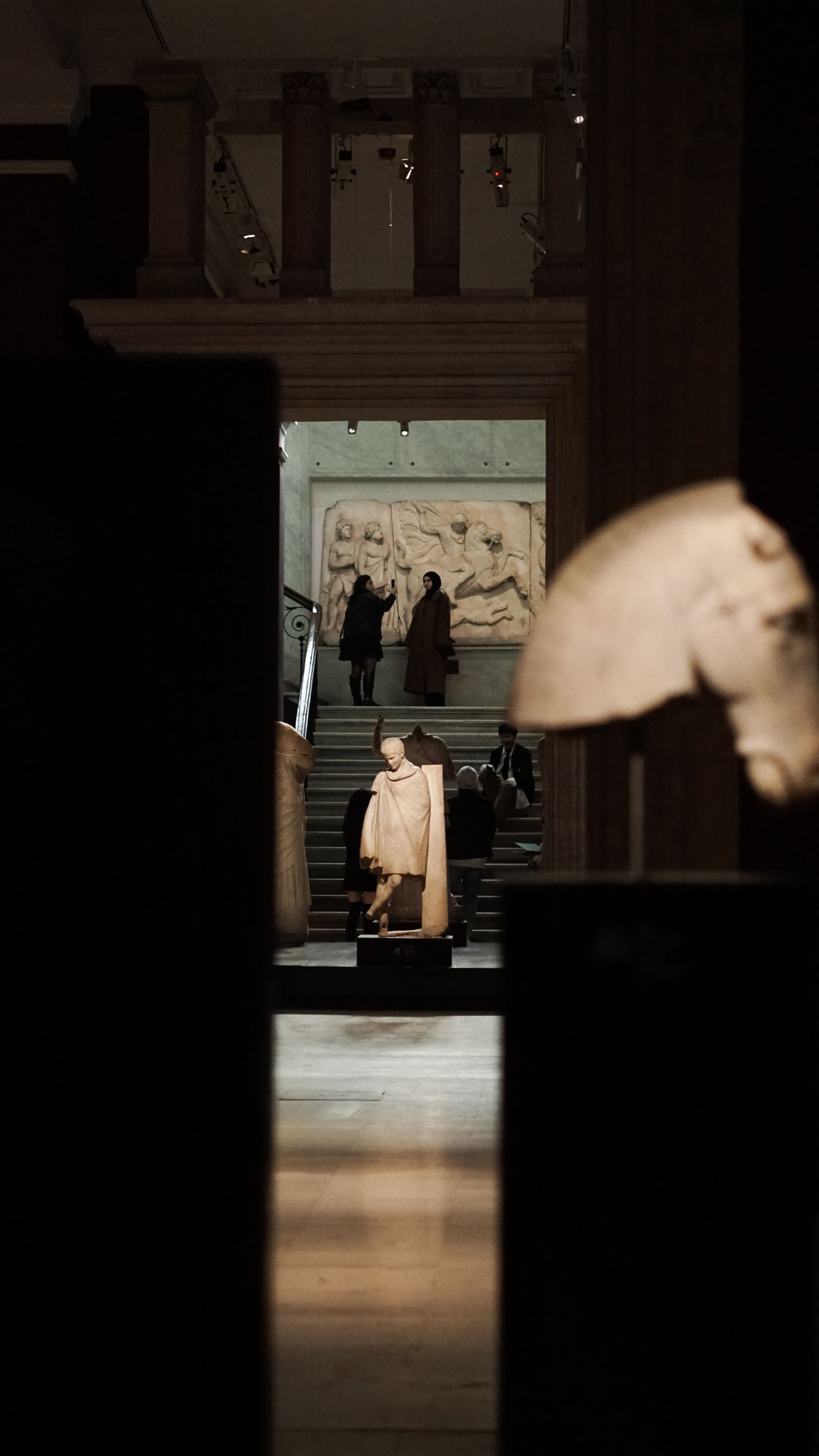 Person Rfecting Silhouette of Person Reflecting in Museum Exhibit · Free Stock Photo