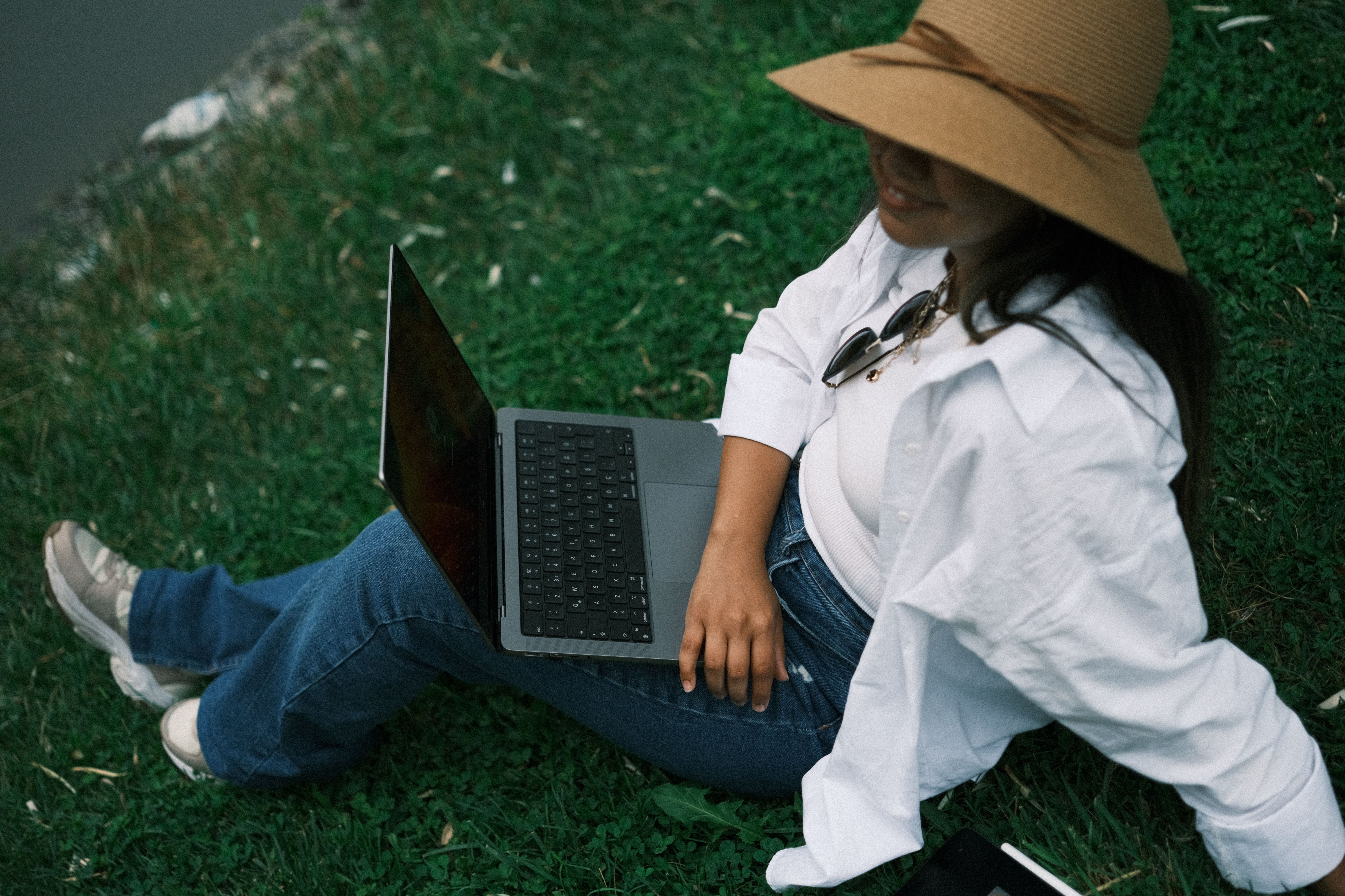 Woman Working on Laptop by the Lake · Free Stock Photo