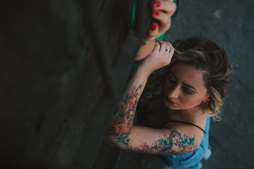 Woman with Tattoos on Hand