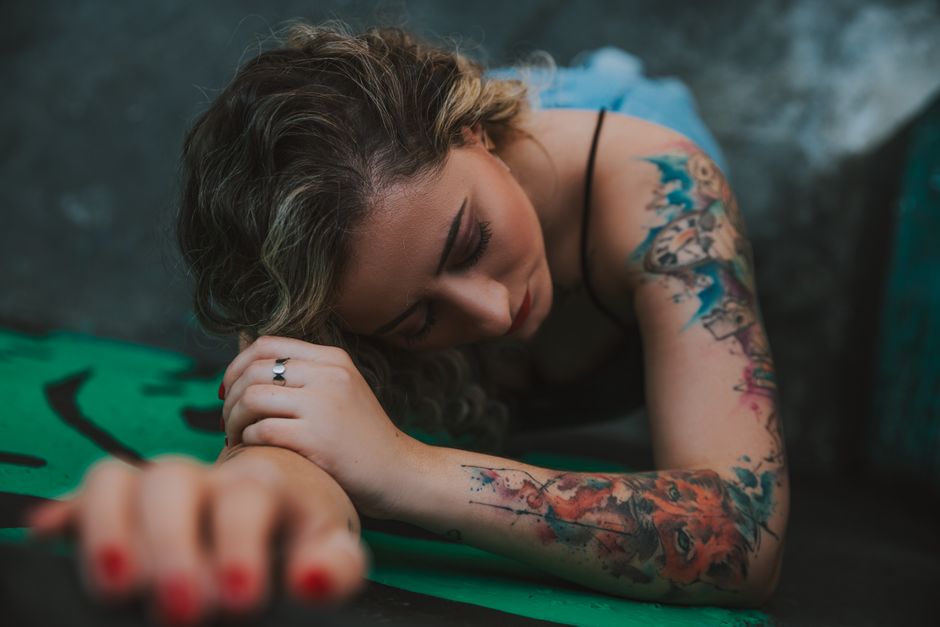 Trash Polka tattooing style showing black realism layered with abstract red strokes Trash Polka tattooing style showing black realism layered with abstract red strokes