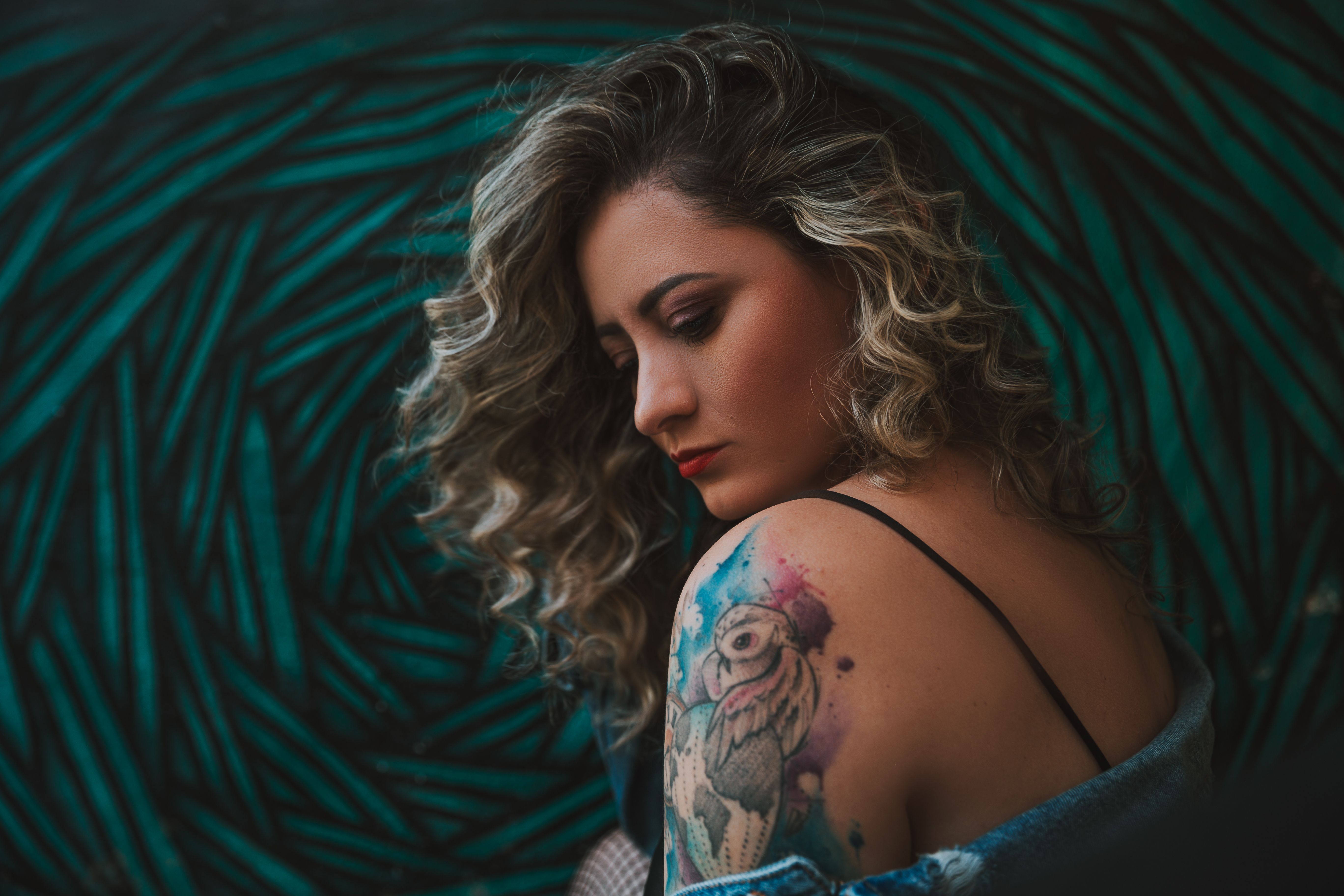 Tattoo apprentice practicing realism and composition under a mentor's guidance