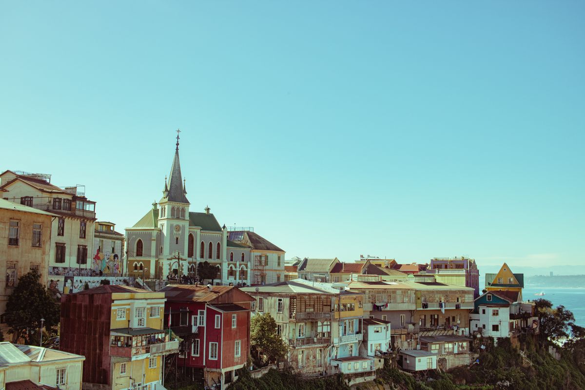 Brightly coloured hillside houses above the sea in Valparaiso