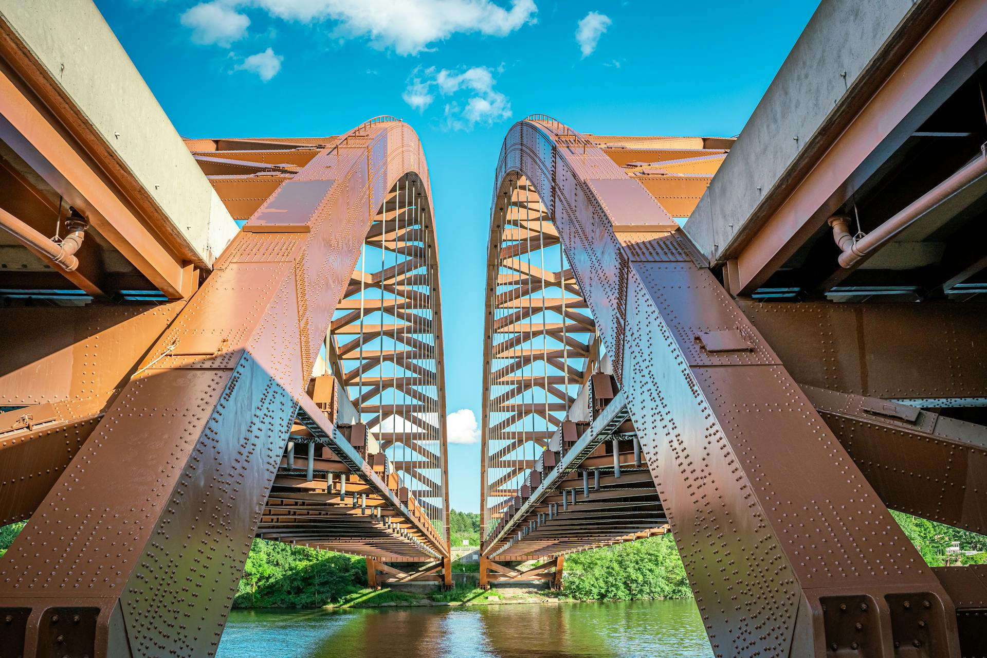 The Thaddeus Kosciusko Twin Bridges span the Mohawk River in New York on a sunny day.