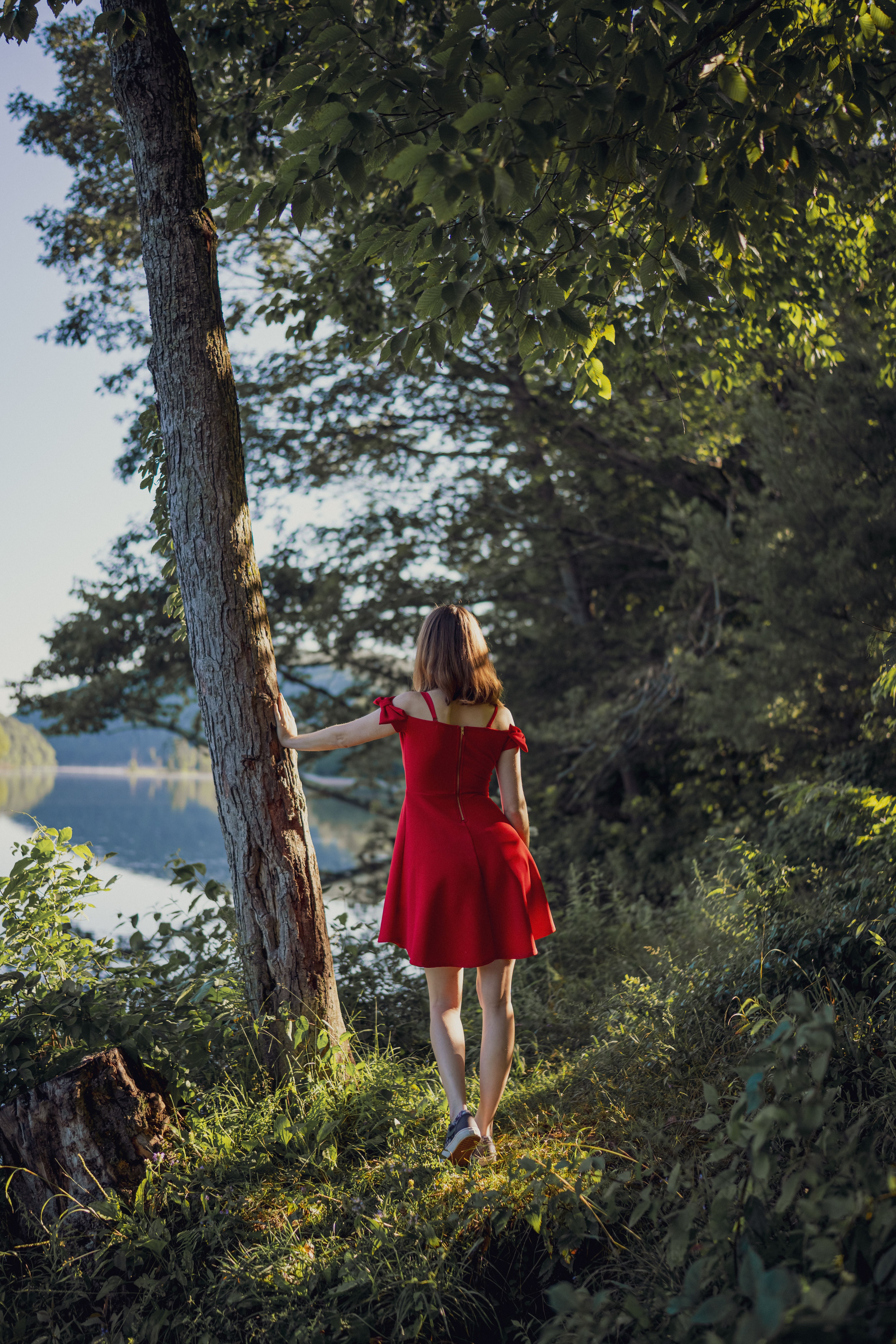 Woman in Red Dress Standing near Lake · Free Stock Photo