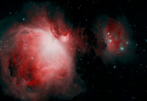 Dazzling image of the Orion Nebula, showcasing its vibrant red and white hues in the vast cosmos.