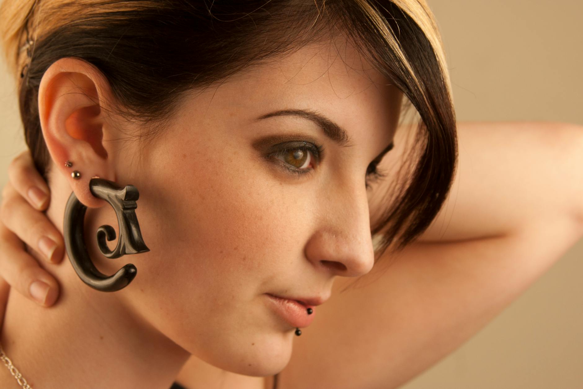 Woman with Plug in Ear