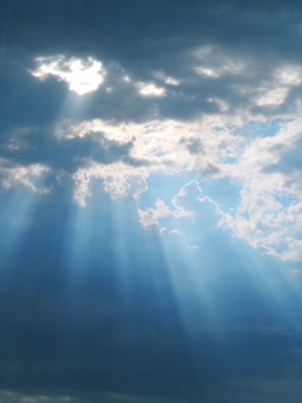 Majestic Sunbeams Breaking Through Clouds · Free Stock Photo