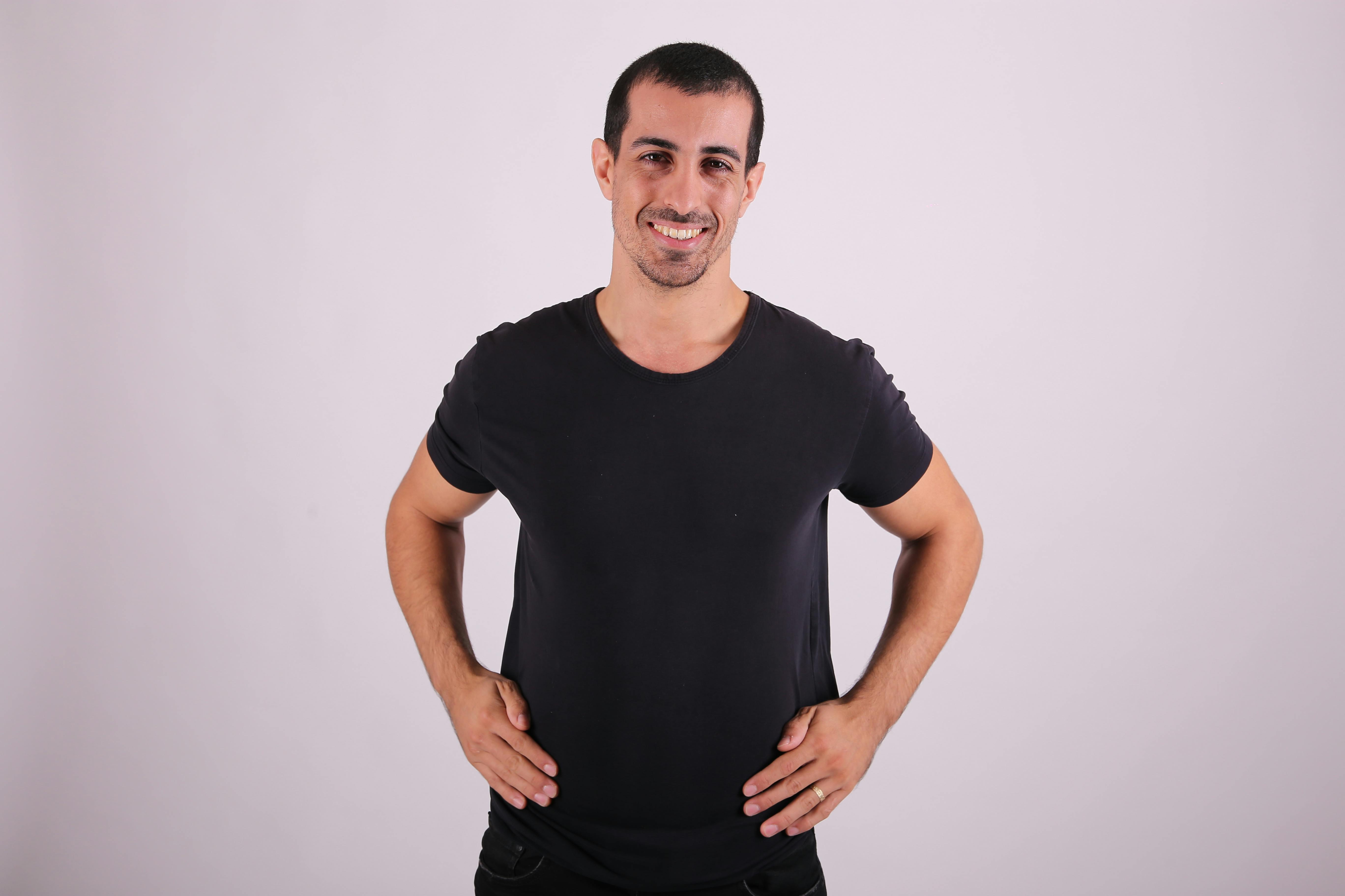 a man in black shirt posing for a photo
