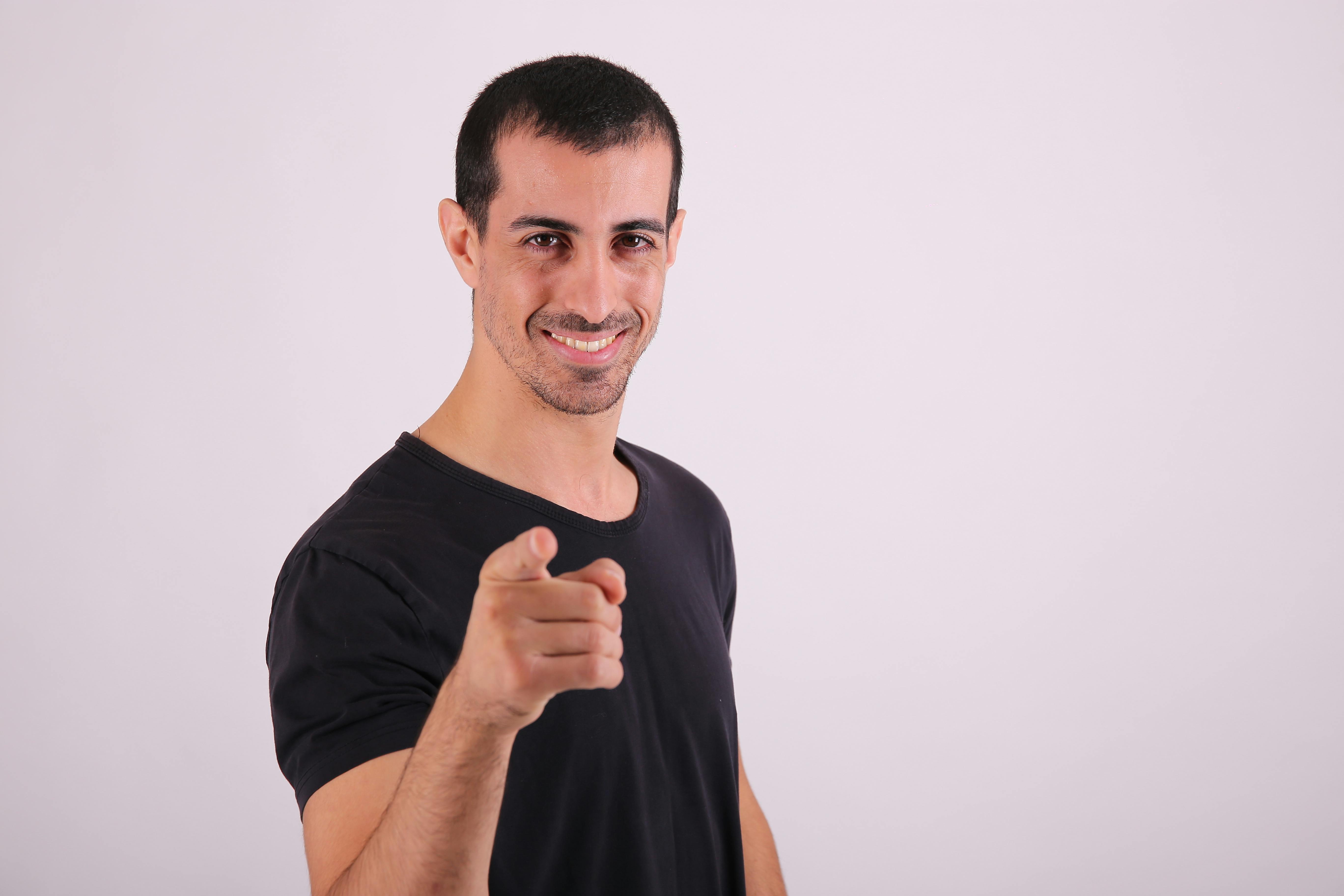 man pointing at camera with his finger