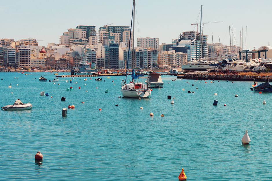 Breathtaking Private Day Charter on Amazing Mowgli Review: Your Ultimate Malta Yacht Experience Review 2026 - Explore the vibrant Valletta harbor filled with boats, yachts, and a stunning cityscape under a summer sky.