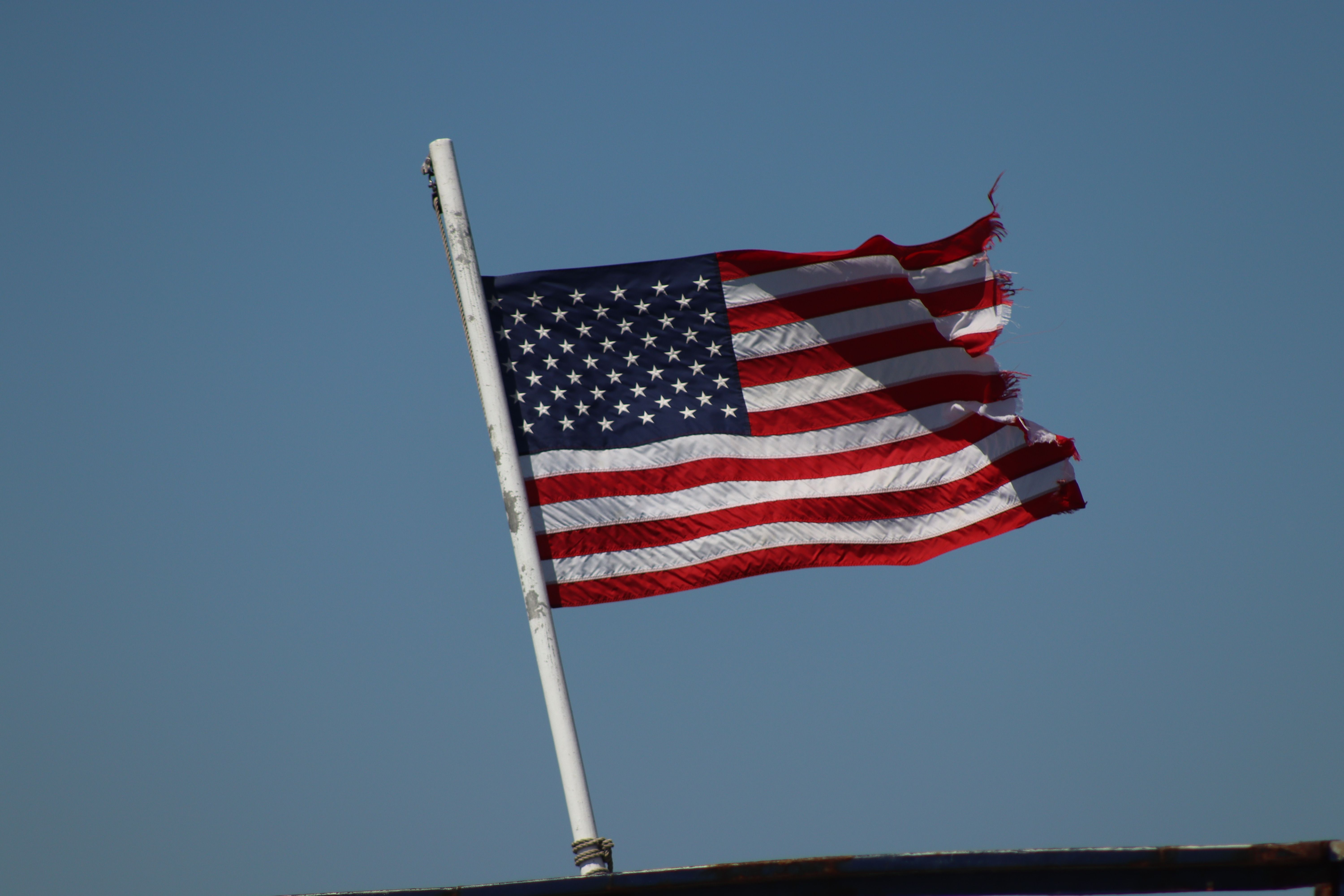 American Flag on the Background of Blue Sky · Free Stock Photo