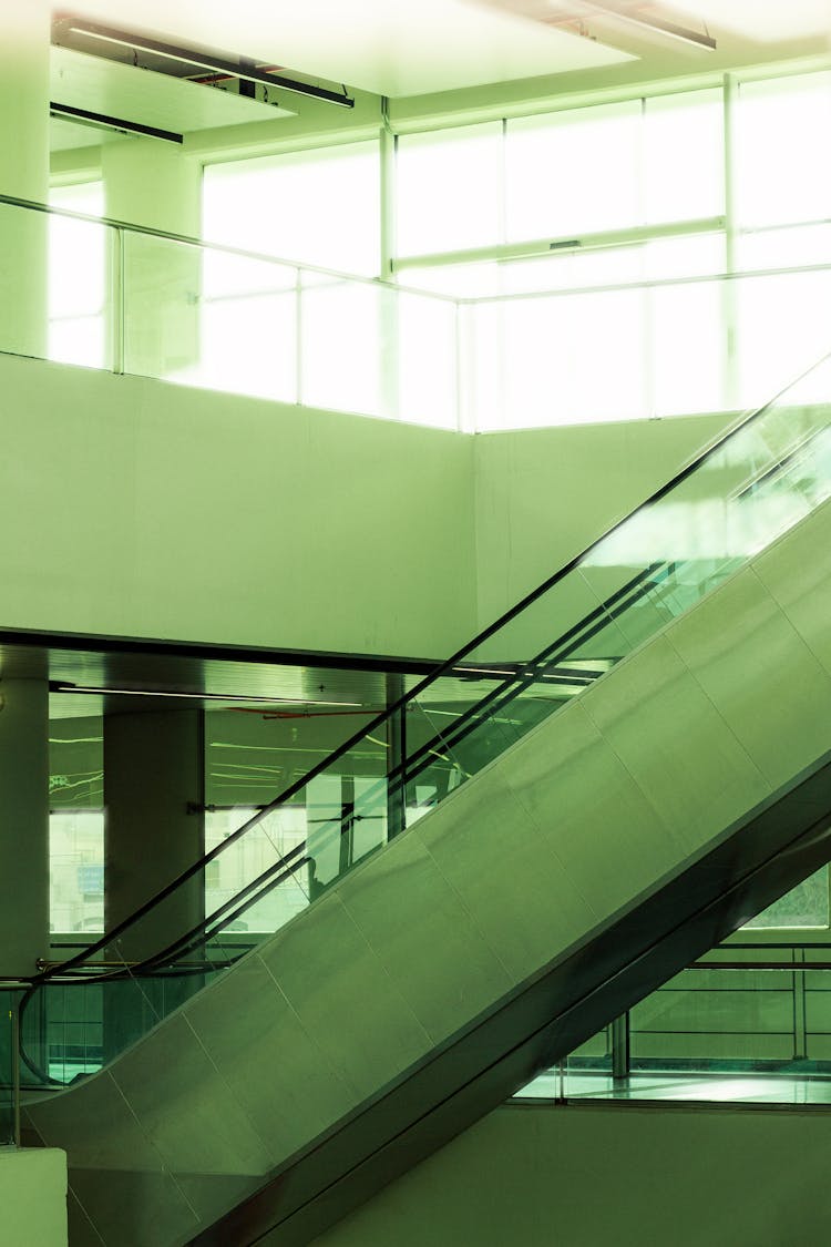 Escalators At An Empty Sunlit Mall