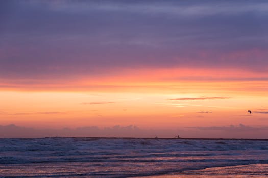 Breathtaking sunset over the North Sea at IJmuiden beach, capturing serene coastal beauty.