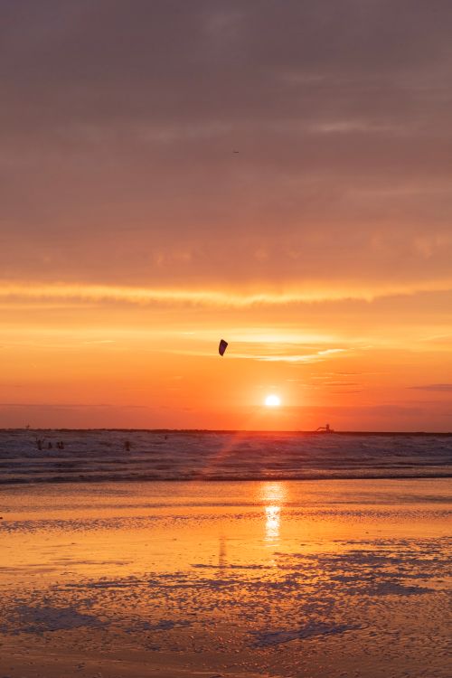 Free Dramatic sunset over the seashore at IJmuiden, Netherlands, capturing a serene ocean view. Stock Photo