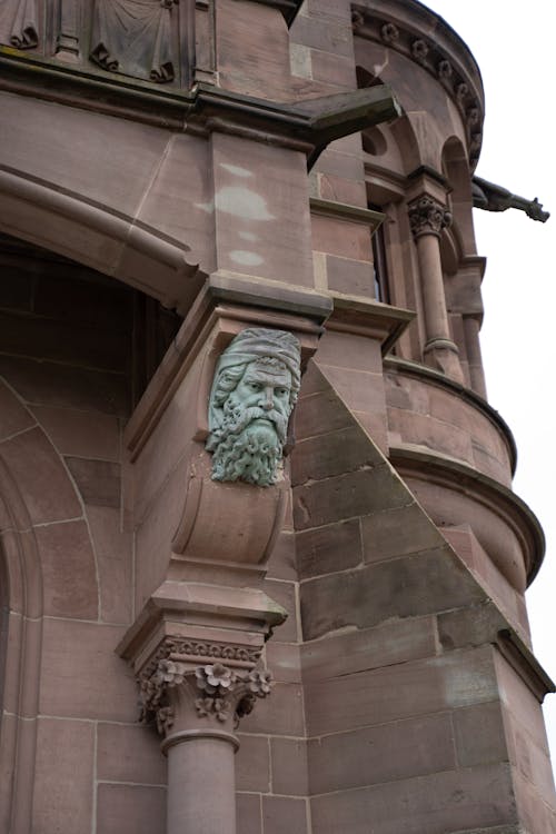 Head Sculpture on Church Wall