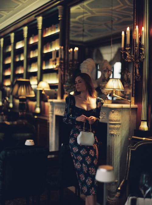 Woman in Dress and with Bag at Luxury Restaurant