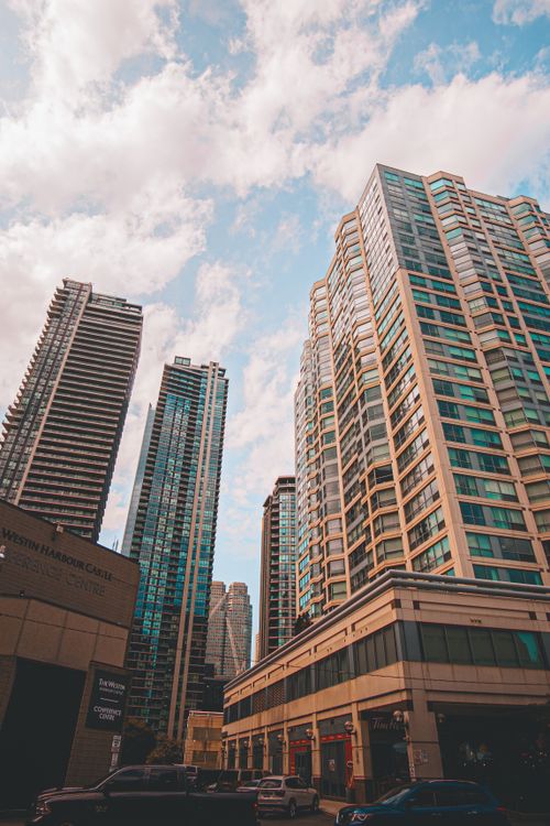 Free A stunning view of modern skyscrapers reaching the sky in an urban cityscape. Stock Photo