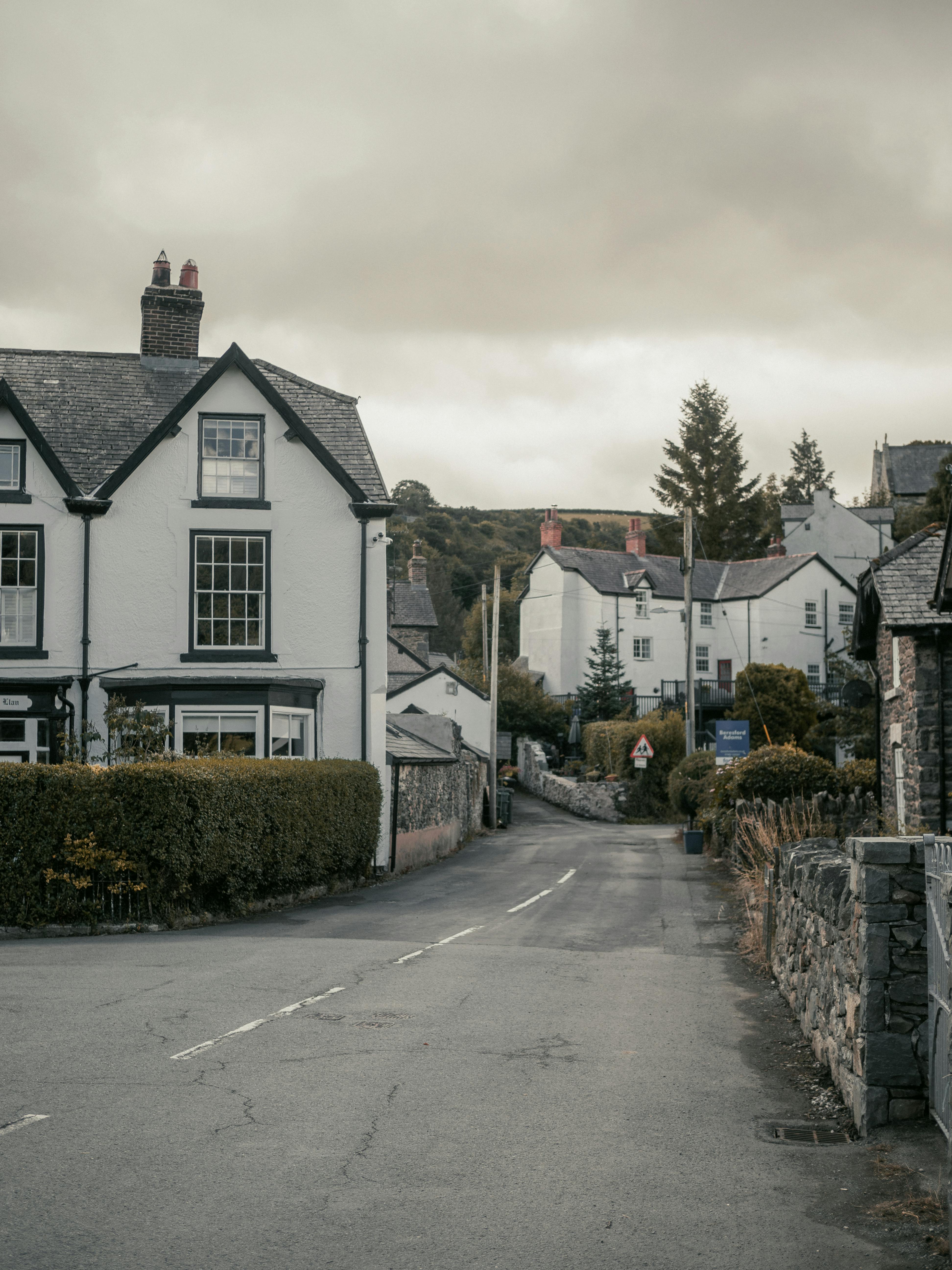 Idyllic street view in Llanfair Talhaiarn, Wales showcasing traditional architecture.