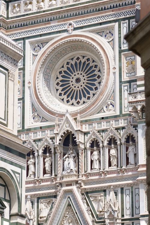 Free Detailed view of the ornate Gothic facade of Florence Cathedral adorned with statues and intricate designs. Stock Photo