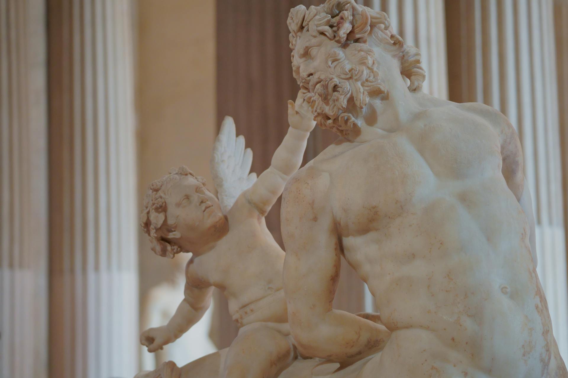 Eros on Old Centaur Sculpture in Louvre Museum