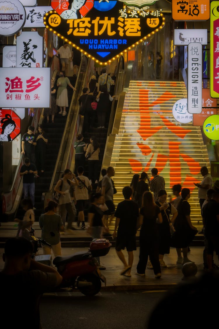 People In Alley In City At Night