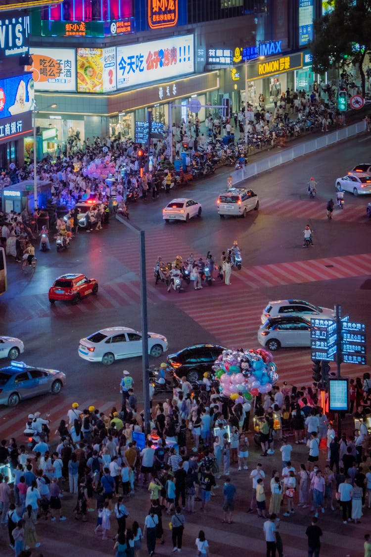 Crowd In City At Night