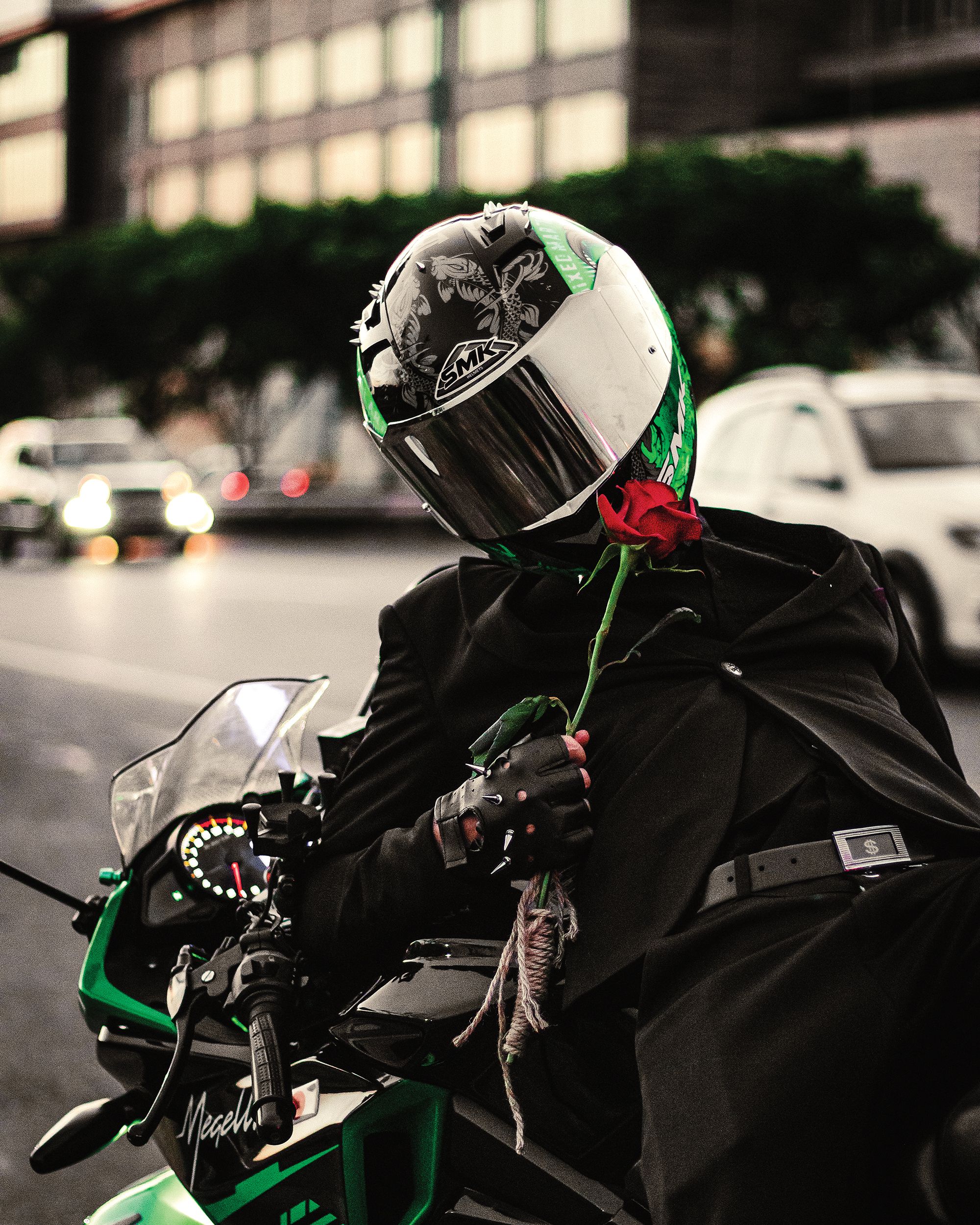 Motorcyclist Holding Rose Flower · Free Stock Photo