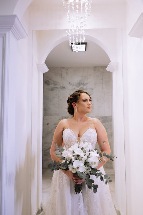 Bride in Wedding Dress and with Bouquet