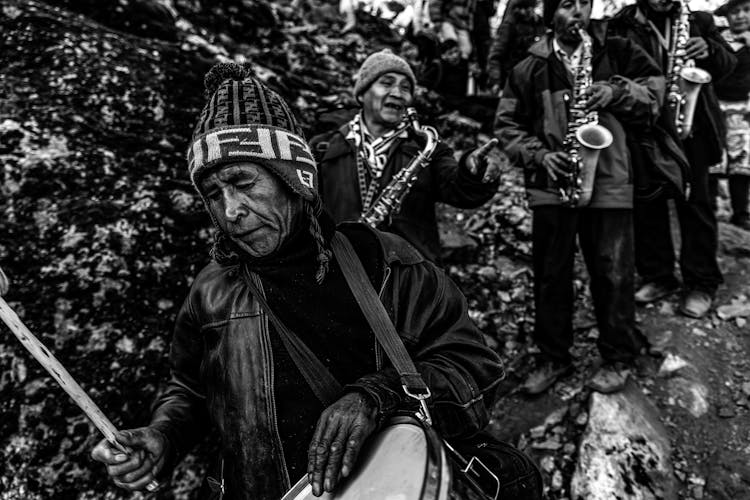 A Group Of People With Instruments