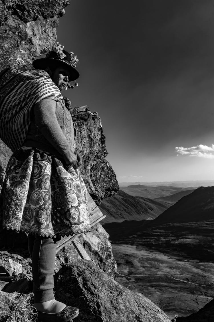 Man Standing On A Mountain With A View Of The Valley 