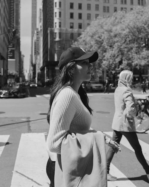 Young Woman at the Crosswalk in City 